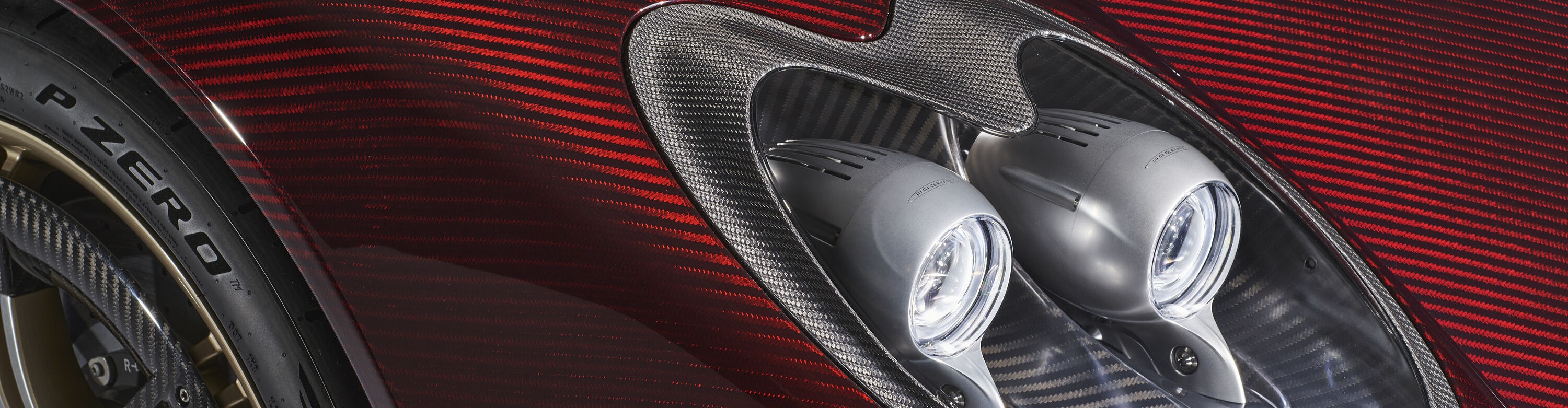 Pagani Utopia Roadster — the quad headlamp cluster set into exposed red carbon fibre bodywork